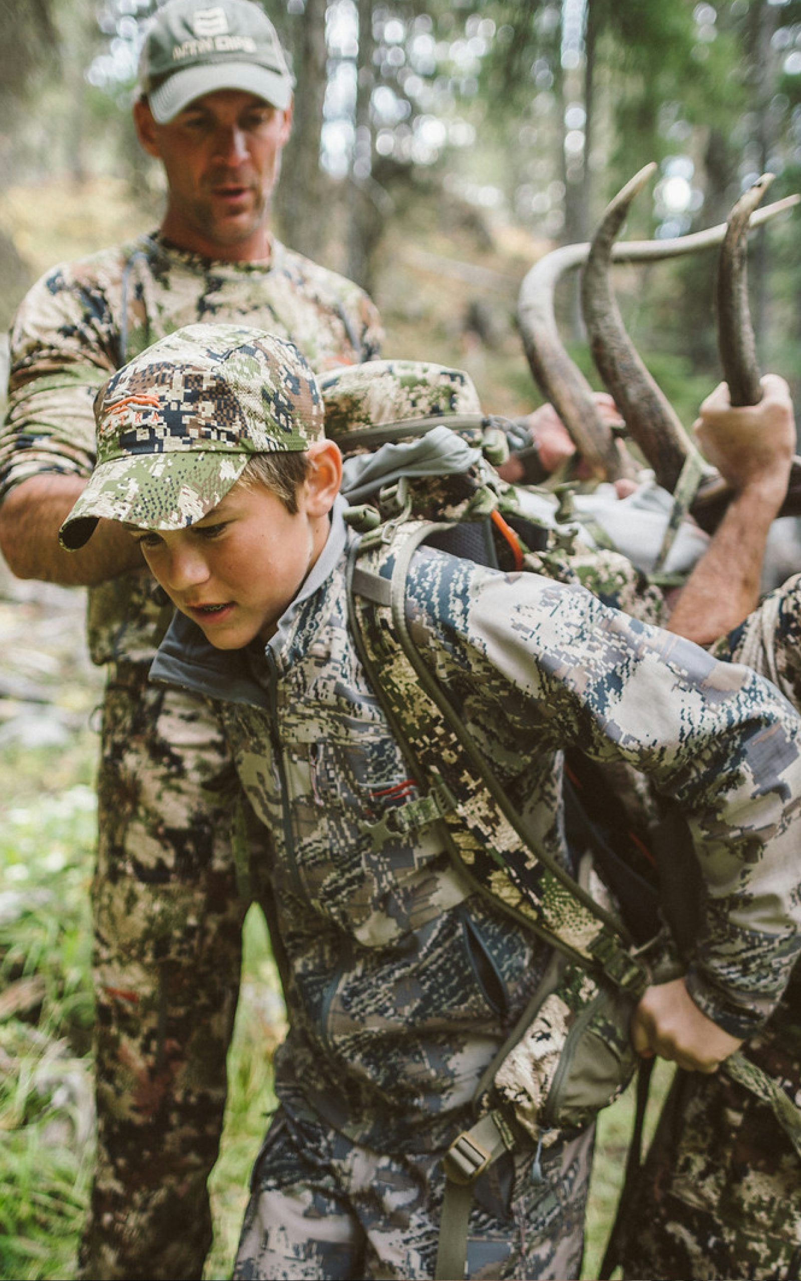 Corey Jacobsen helping his son pack out his bull elk | SITKA Gear