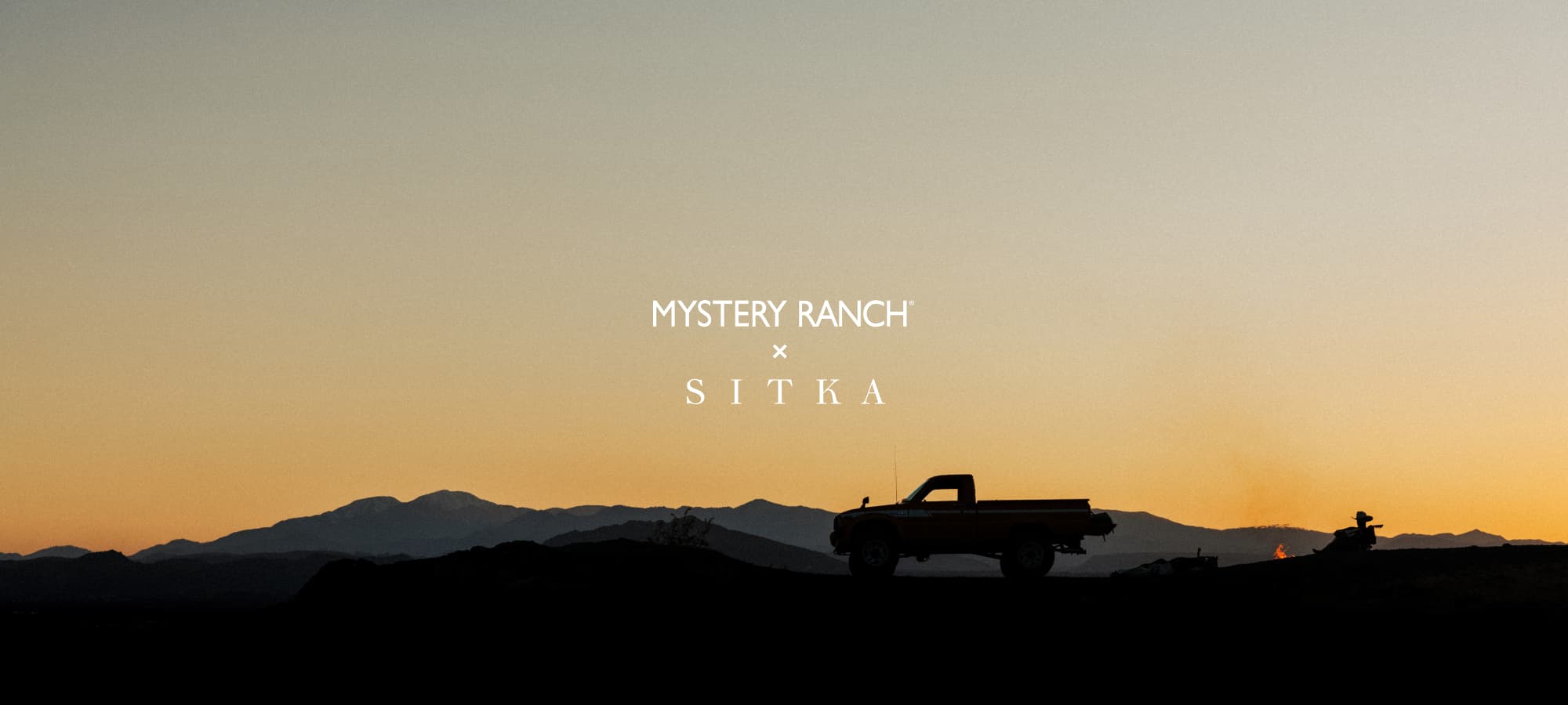 Brad Christian playing his guitar in the desert | SITKA Gear