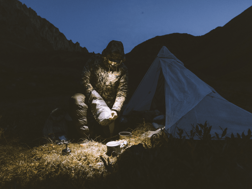 Man digging into dry sack for some food | SITKA Gear