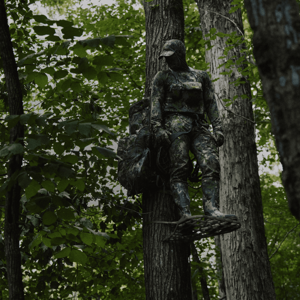 Whitetail hunter in his treestand wearing the Equinox Guard Collection in Optifade Cover | SITKA Gear