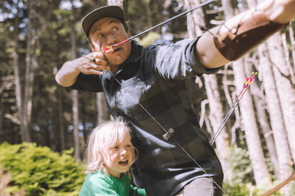 Man shooting his long bow with his daughter | SITKA Gear