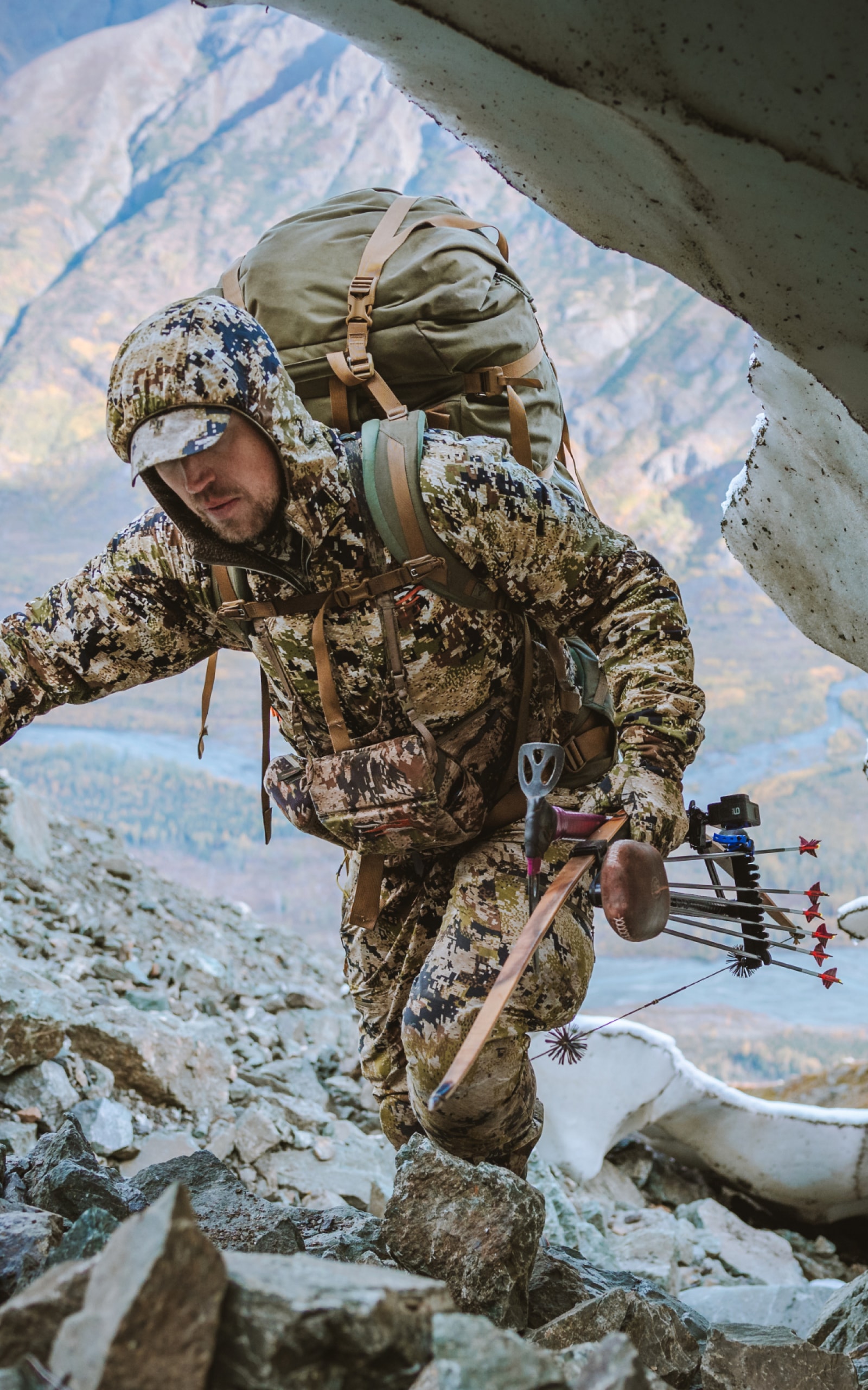 Man trekking up mountain | SITKA Gear