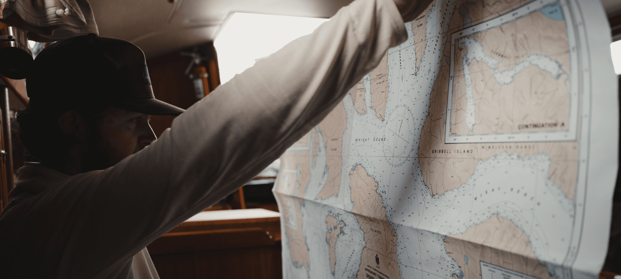 Connor Gabbott looking at a map - Ebb and Flow | SITKA Gear