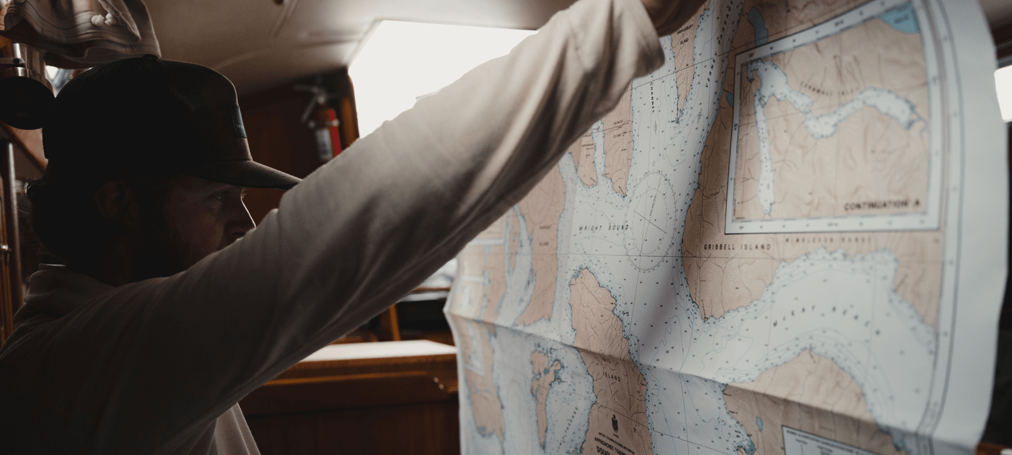 Connor Gabbott looking at a map - Ebb and Flow | SITKA Gear