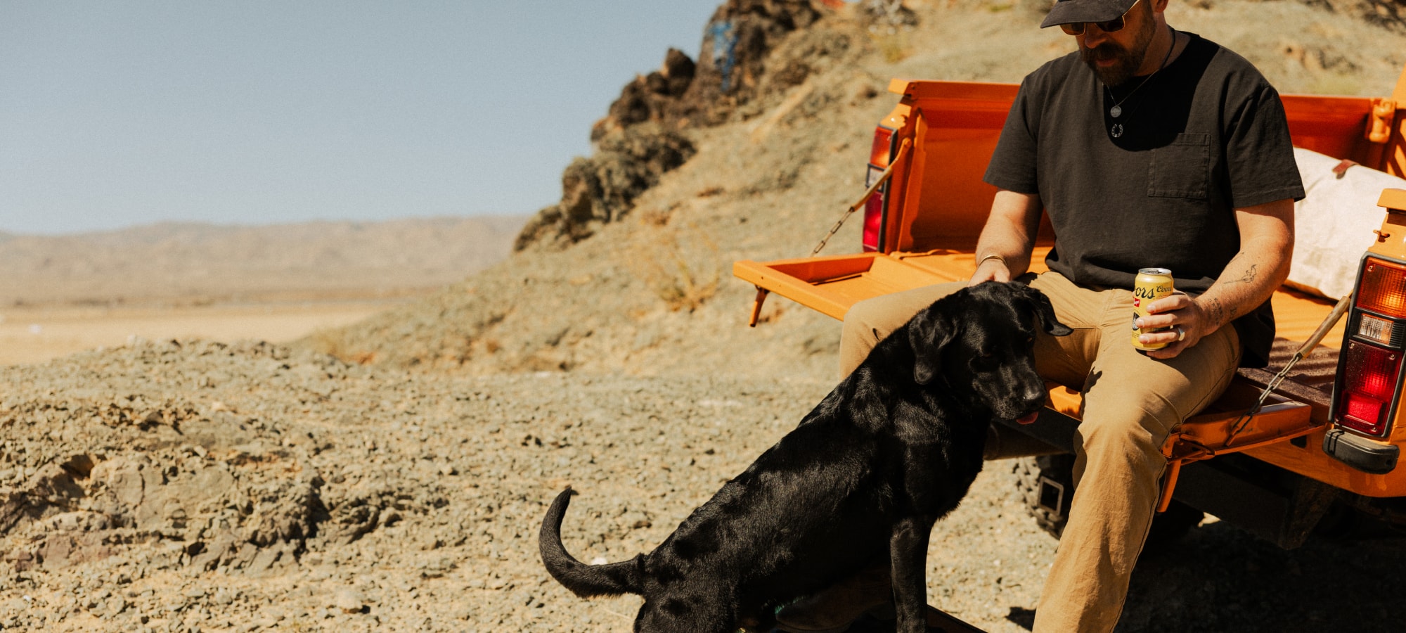 Brad Christian playing with his dog in the Everyday Pant | SITKA Gear